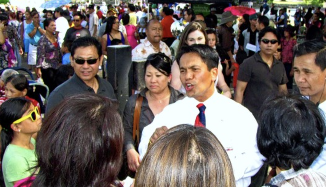 Sam Meas speaking at community rally